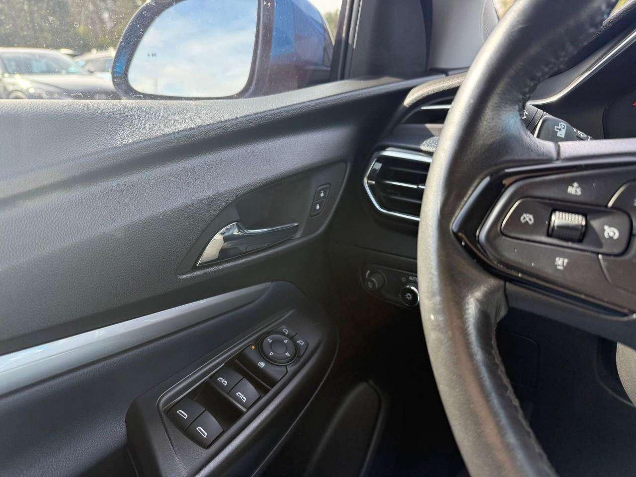 2023 Chevrolet Bolt REAR CARGO STORAGE, DOUBLE FLOOR. WIRELESS CHARGING. REAR PARK ASSIST. HEATED SEATS & STEERING WHEEL. DC FAST CHARGING. Photo