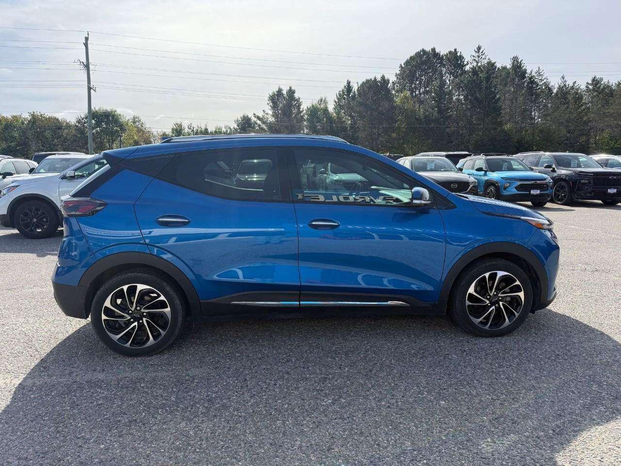2023 Chevrolet Bolt REAR CARGO STORAGE, DOUBLE FLOOR. WIRELESS CHARGING. REAR PARK ASSIST. HEATED SEATS & STEERING WHEEL. DC FAST CHARGING. Photo
