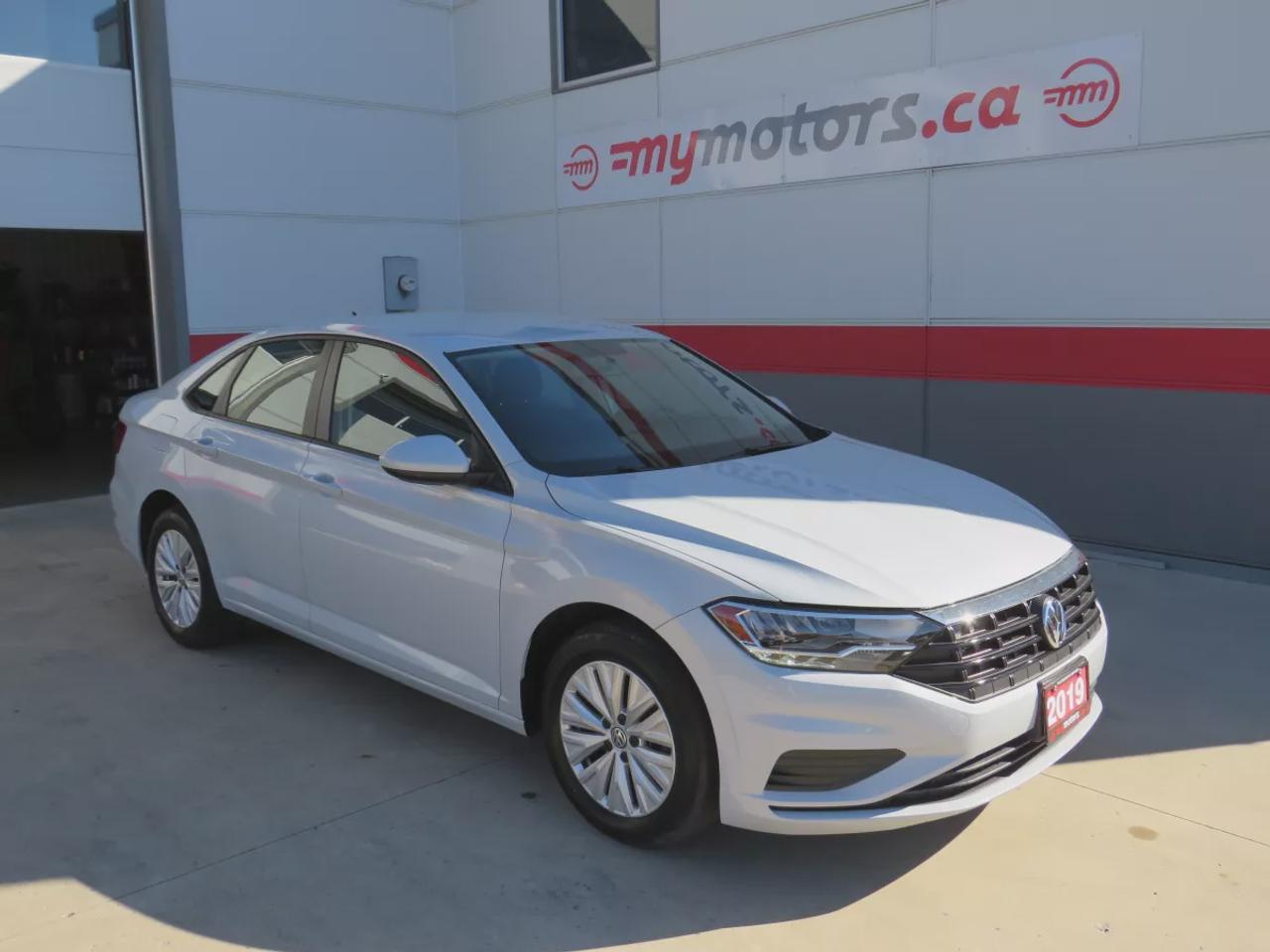 2019 Volkswagen Jetta Comfortline | FWD | Automatic | Low Kms | Alloy Wheels | Heated Seats | Air Conditioning | Touchscreen Display | Apple CarPlay & Android Auto | Bluetooth | Back-Up Camera | Cruise Control | USB Input | Keyless Entry | Heated Power Mirrors Photo