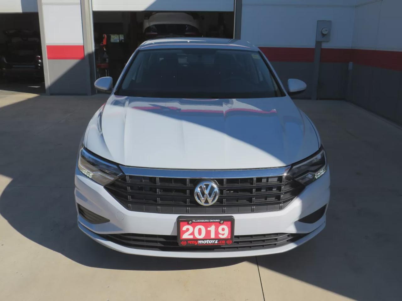 2019 Volkswagen Jetta Comfortline | FWD | Automatic | Low Kms | Alloy Wheels | Heated Seats | Air Conditioning | Touchscreen Display | Apple CarPlay & Android Auto | Bluetooth | Back-Up Camera | Cruise Control | USB Input | Keyless Entry | Heated Power Mirrors Photo