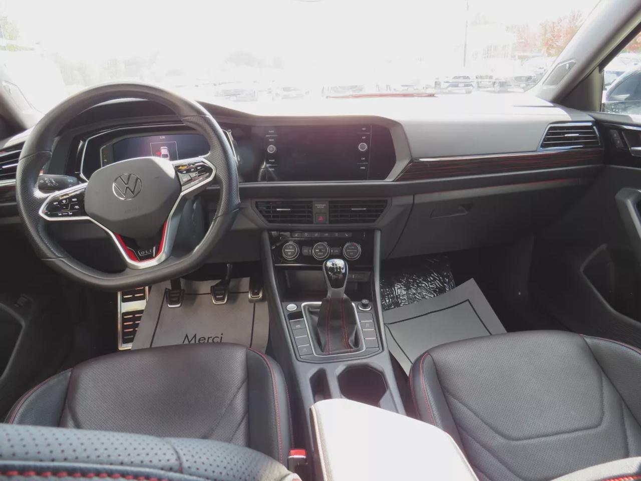 2023 Volkswagen Jetta GLI GLI | FWD | Manual | Low Kms | Alloy Wheels | Leather Seats | Heated & Cooled Front Seats | Heated Rear Seats | Power Driver Seat with Memory | Dual-Zone Climate Control | Power Sunroof | Touchscreen Display | Wireless Apple CarPlay & Android Auto Photo