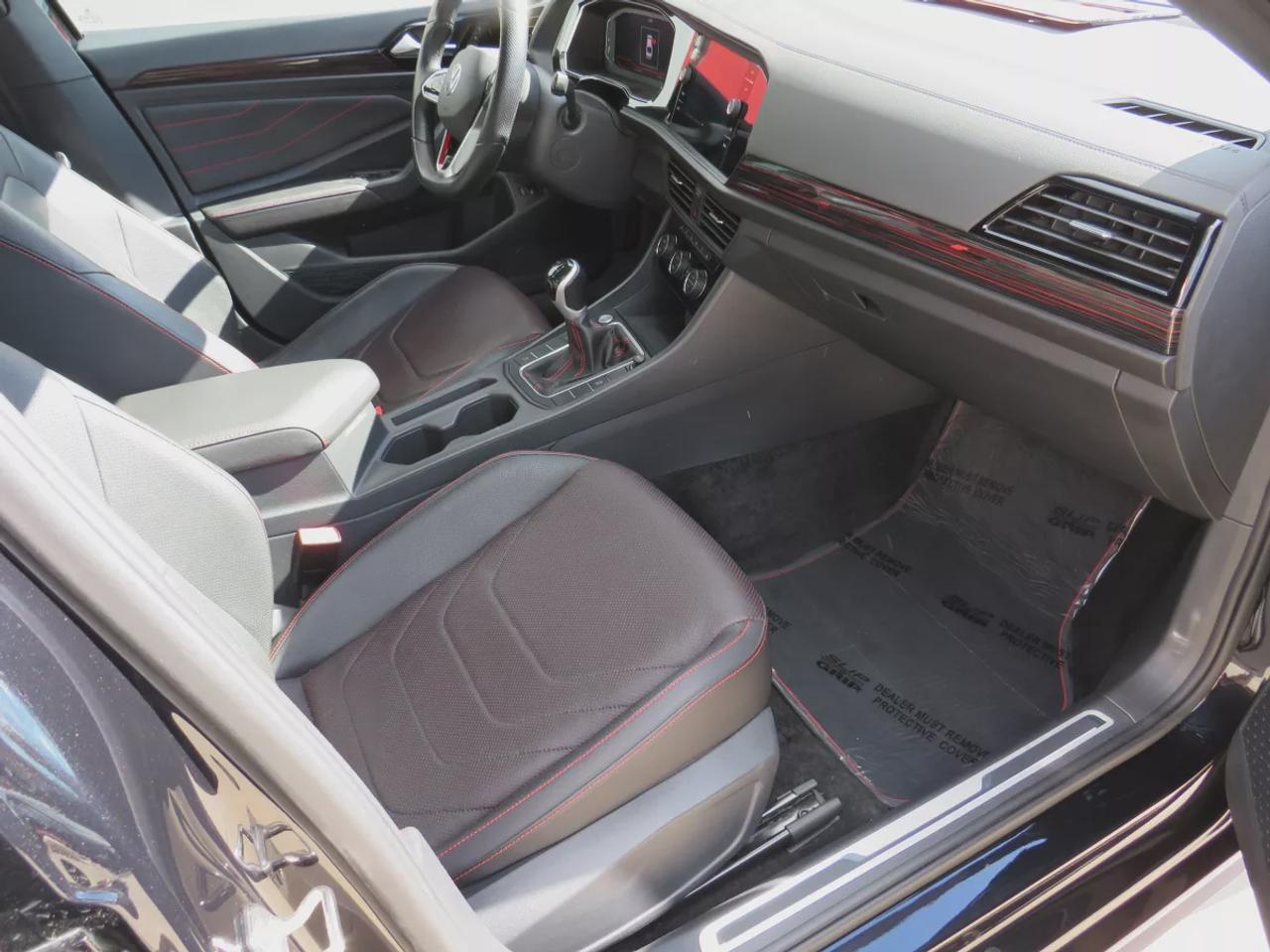 2023 Volkswagen Jetta GLI GLI | FWD | Manual | Low Kms | Alloy Wheels | Leather Seats | Heated & Cooled Front Seats | Heated Rear Seats | Power Driver Seat with Memory | Dual-Zone Climate Control | Power Sunroof | Touchscreen Display | Wireless Apple CarPlay & Android Auto Photo