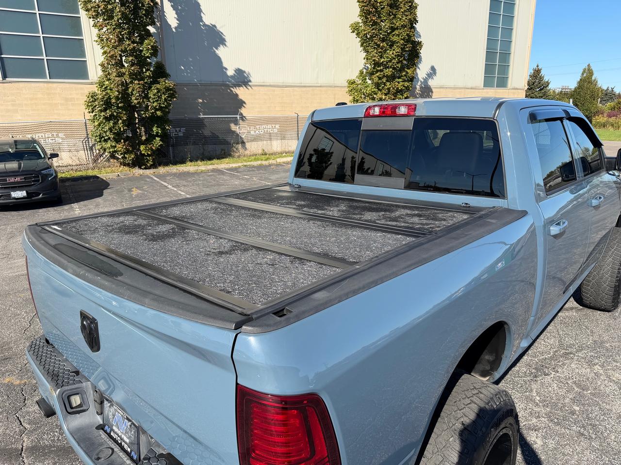 2015 RAM 1500 4WD Crew Cab 140.5" Sport Photo