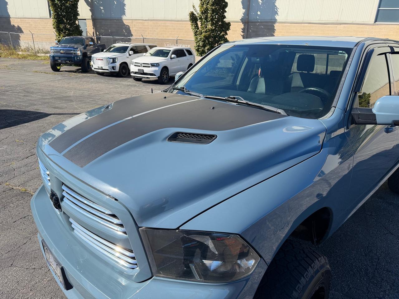 2015 RAM 1500 4WD Crew Cab 140.5" Sport Photo