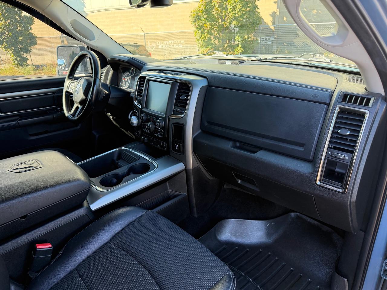 2015 RAM 1500 4WD Crew Cab 140.5" Sport Photo