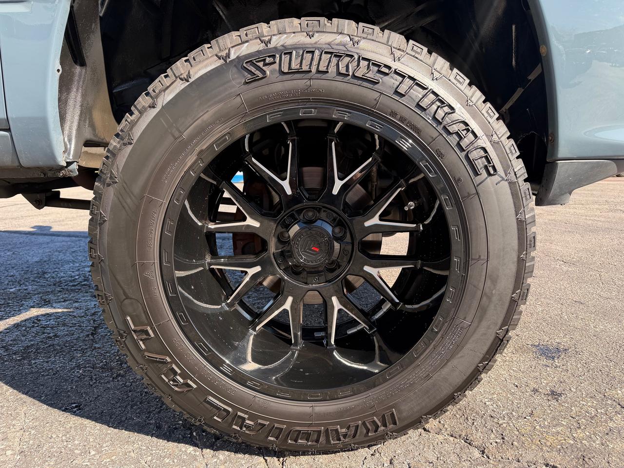 2015 RAM 1500 4WD Crew Cab 140.5" Sport Photo