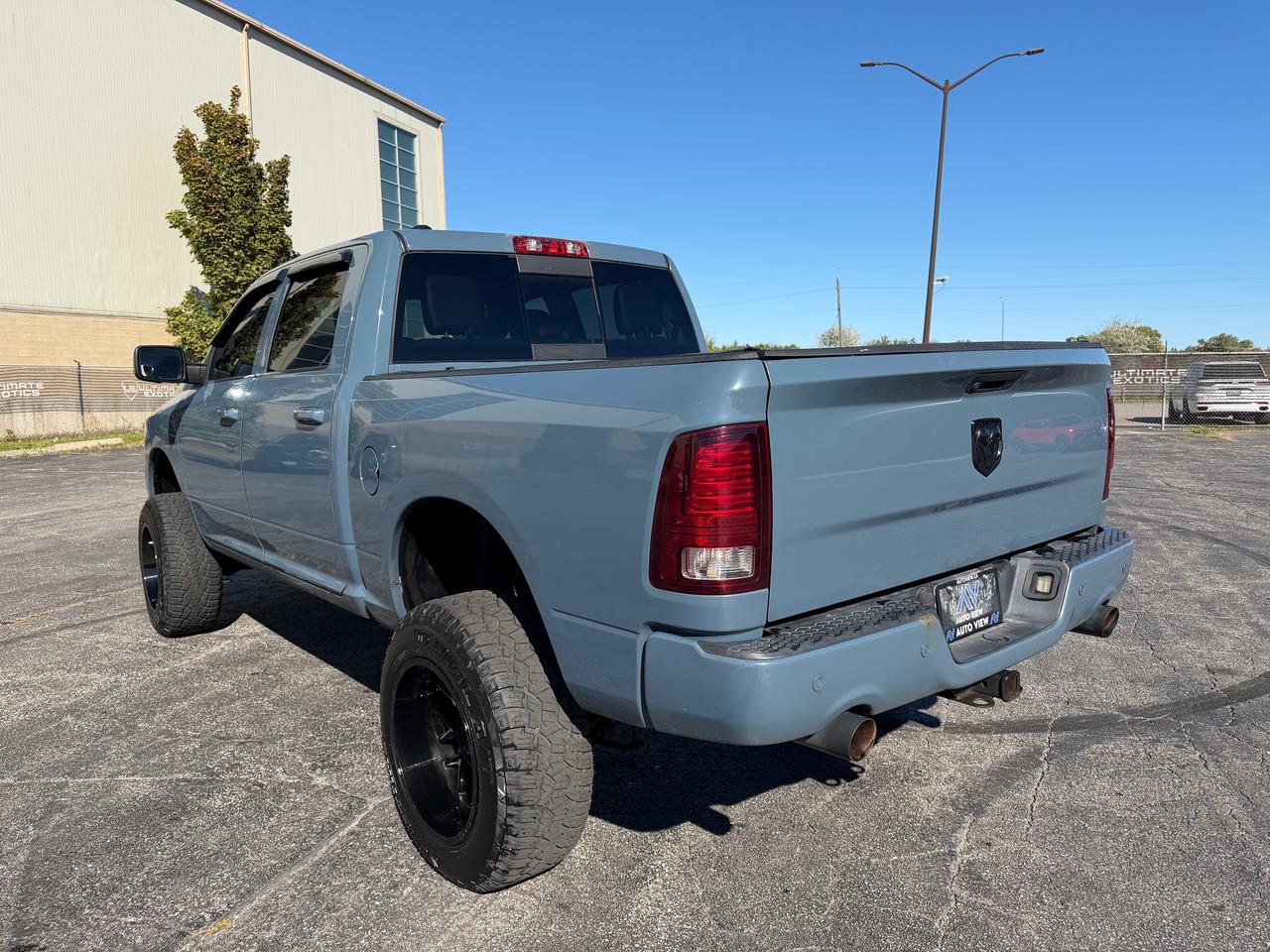 2015 RAM 1500 4WD Crew Cab 140.5" Sport Photo