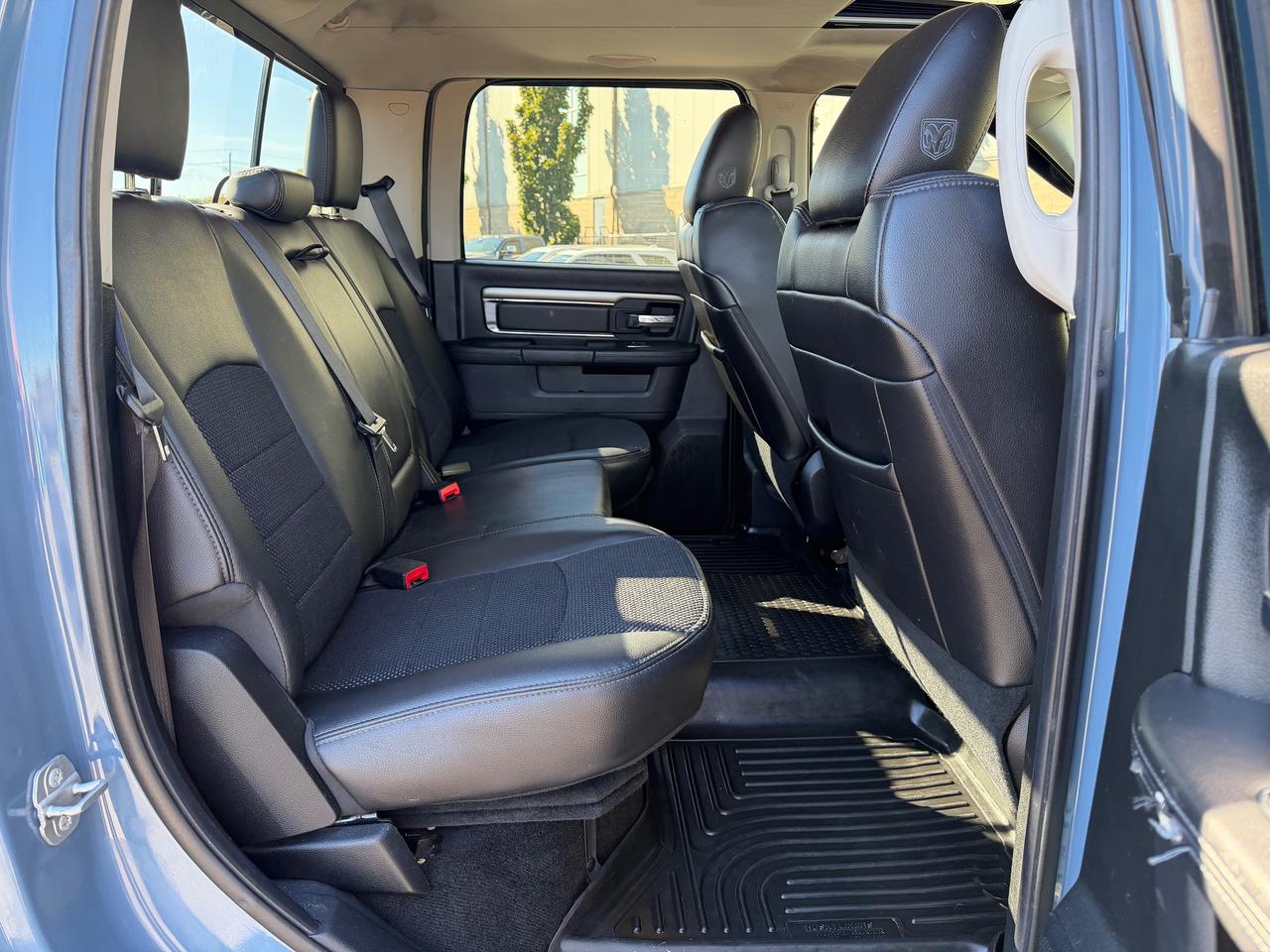 2015 RAM 1500 4WD Crew Cab 140.5" Sport Photo