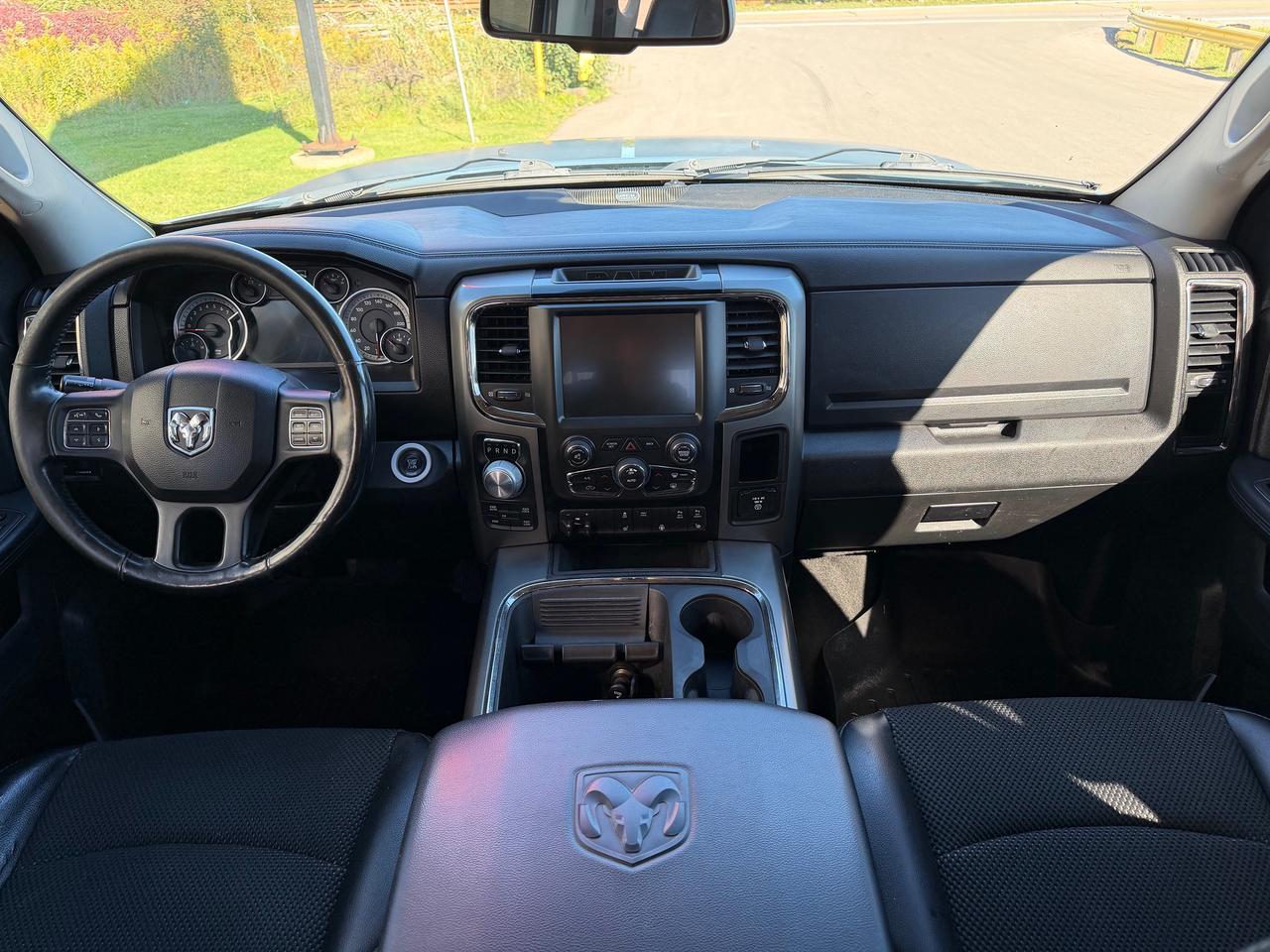 2015 RAM 1500 4WD Crew Cab 140.5" Sport Photo
