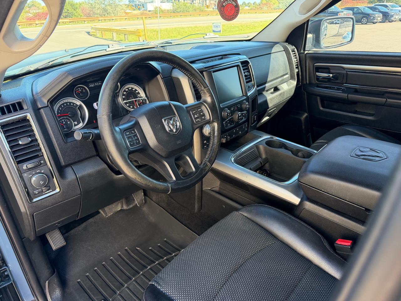 2015 RAM 1500 4WD Crew Cab 140.5" Sport Photo