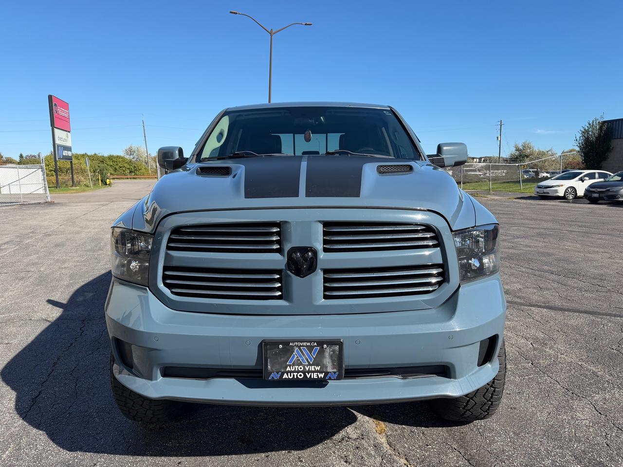 2015 RAM 1500 4WD Crew Cab 140.5" Sport Photo1