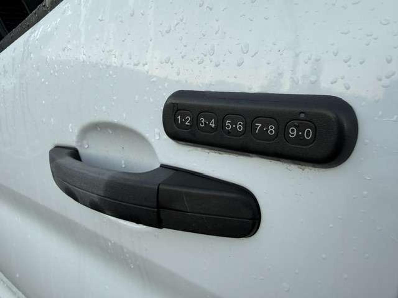 2023 Ford Transit Mid roof, Divider, Certified. no windows. Photo