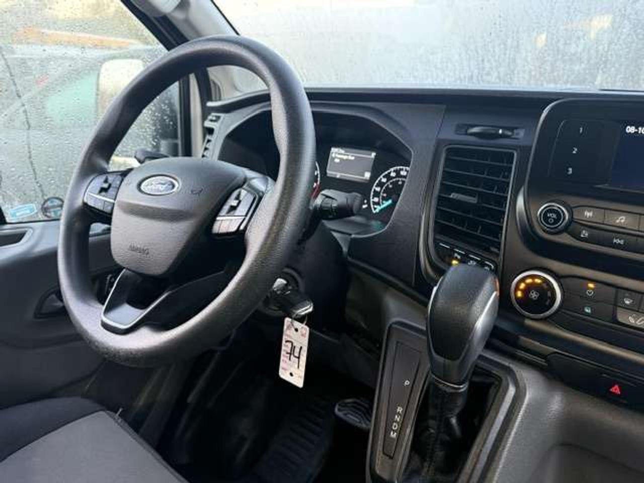 2023 Ford Transit Mid roof, Divider, Certified. no windows. Photo