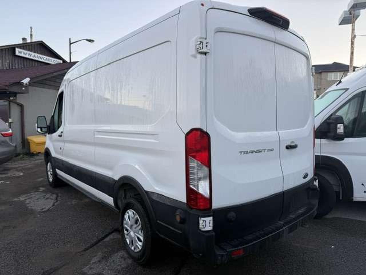 2023 Ford Transit Mid roof, Divider, Certified. no windows. Photo