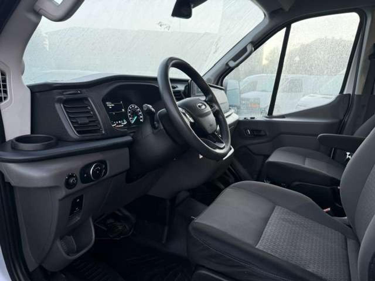 2023 Ford Transit Mid roof, Divider, Certified. no windows. Photo