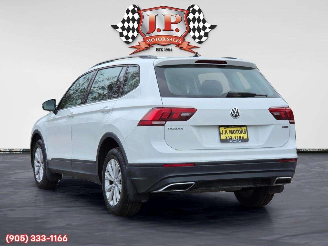 2021 Volkswagen Tiguan Trendline Apple CarPlay & Android Auto • Heated Front Seats • Lane Assist • Keyless Entry • Alloy Wheels Photo
