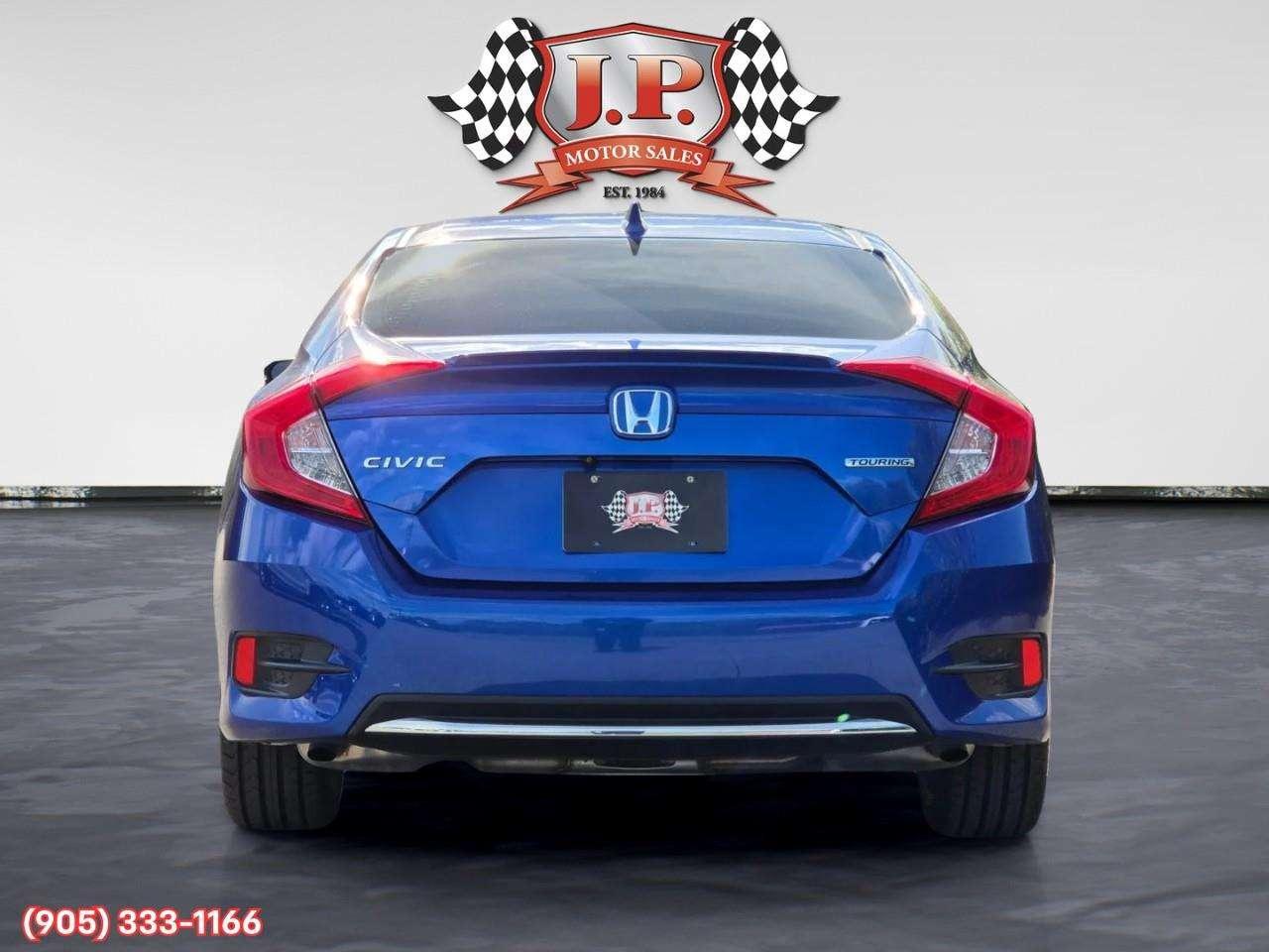 2019 Honda Civic Touring Apple CarPlay & Android Auto • Power Sunroof • Leather Seating • Built-In Navigation System • Remote Start System Photo