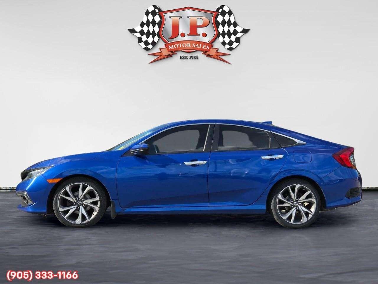 2019 Honda Civic Touring Apple CarPlay & Android Auto • Power Sunroof • Leather Seating • Built-In Navigation System • Remote Start System Photo