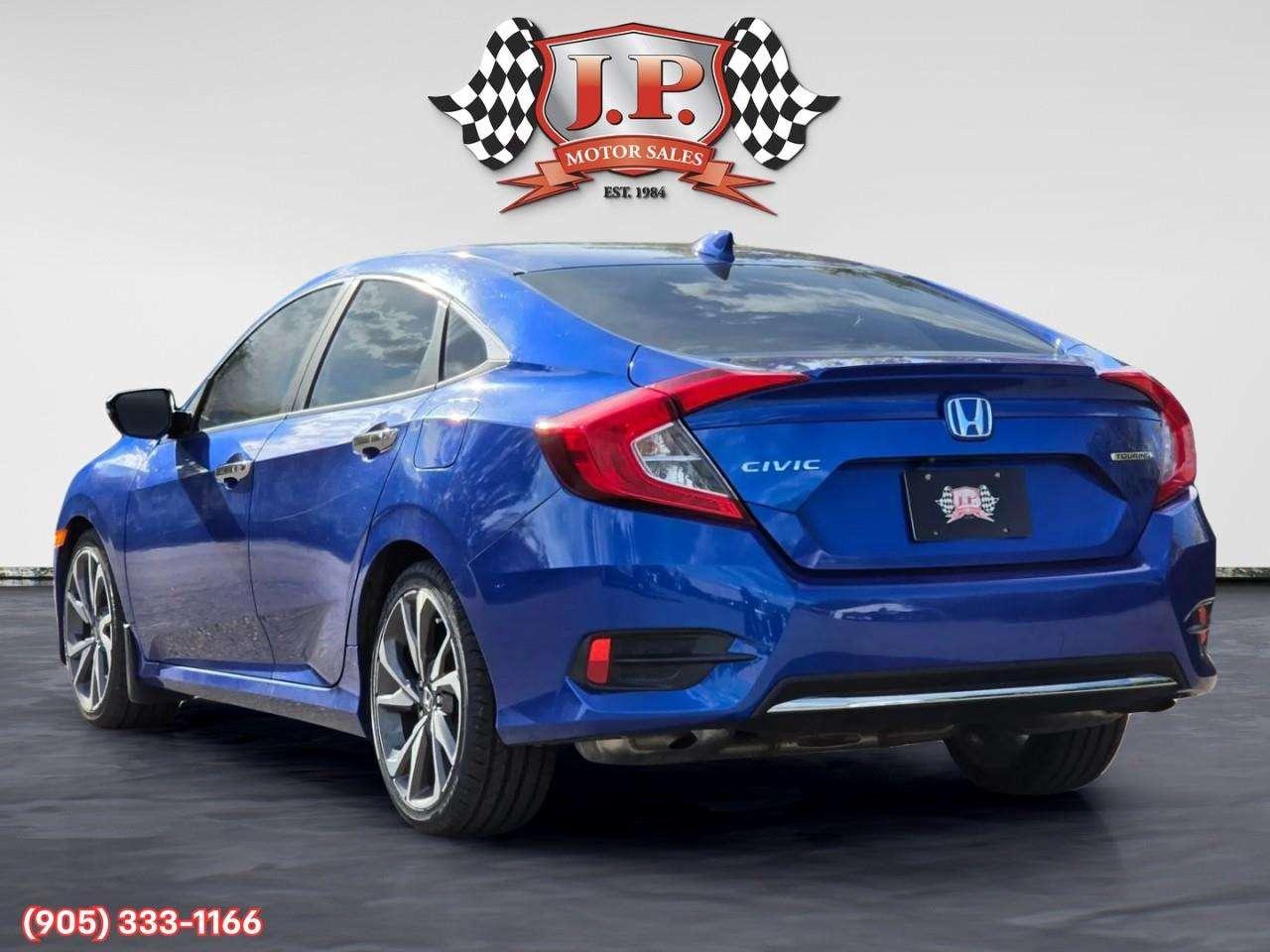 2019 Honda Civic Touring Apple CarPlay & Android Auto • Power Sunroof • Leather Seating • Built-In Navigation System • Remote Start System Photo