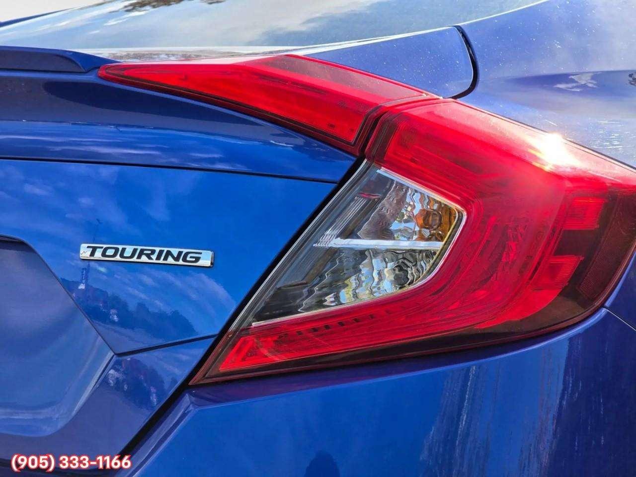 2019 Honda Civic Touring Apple CarPlay & Android Auto • Power Sunroof • Leather Seating • Built-In Navigation System • Remote Start System Photo
