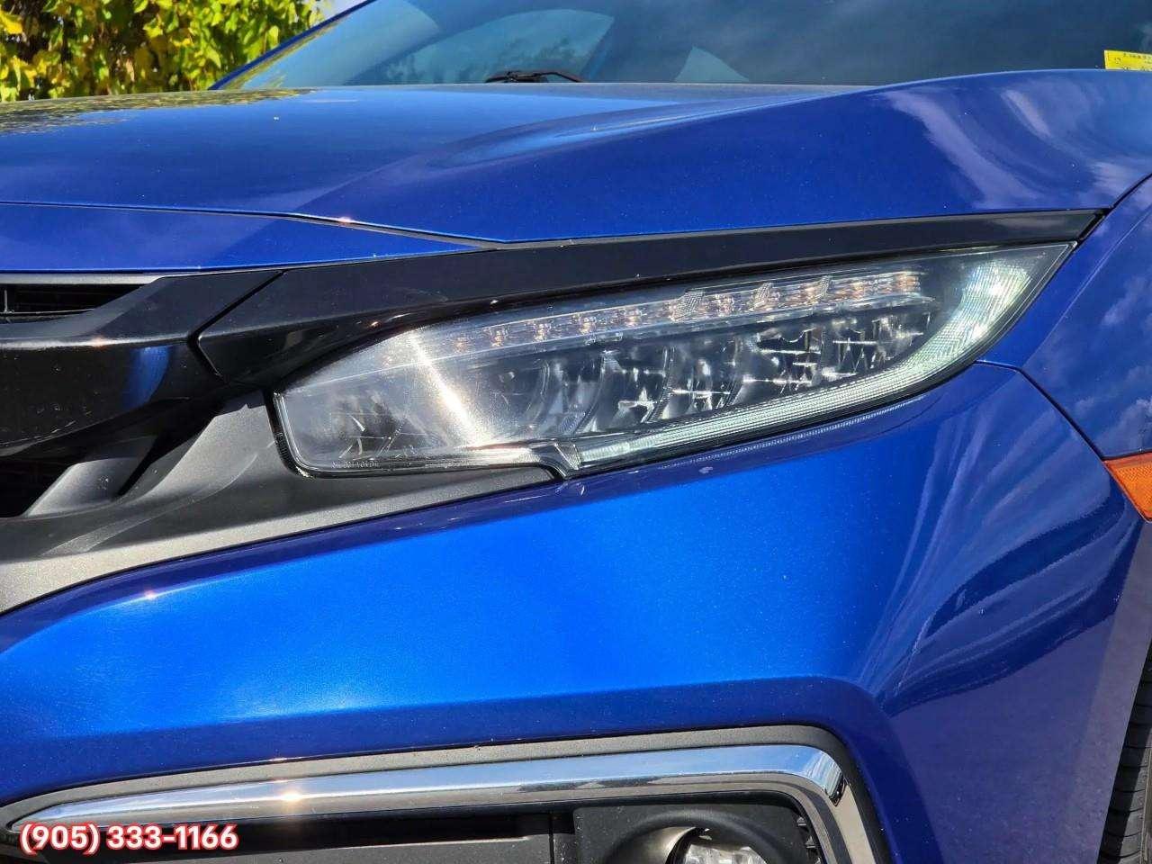 2019 Honda Civic Touring Apple CarPlay & Android Auto • Power Sunroof • Leather Seating • Built-In Navigation System • Remote Start System Photo