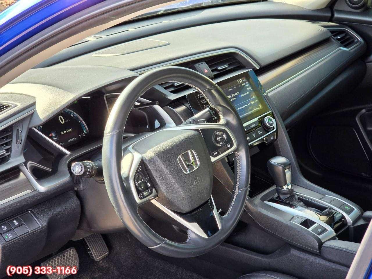 2019 Honda Civic Touring Apple CarPlay & Android Auto • Power Sunroof • Leather Seating • Built-In Navigation System • Remote Start System Photo