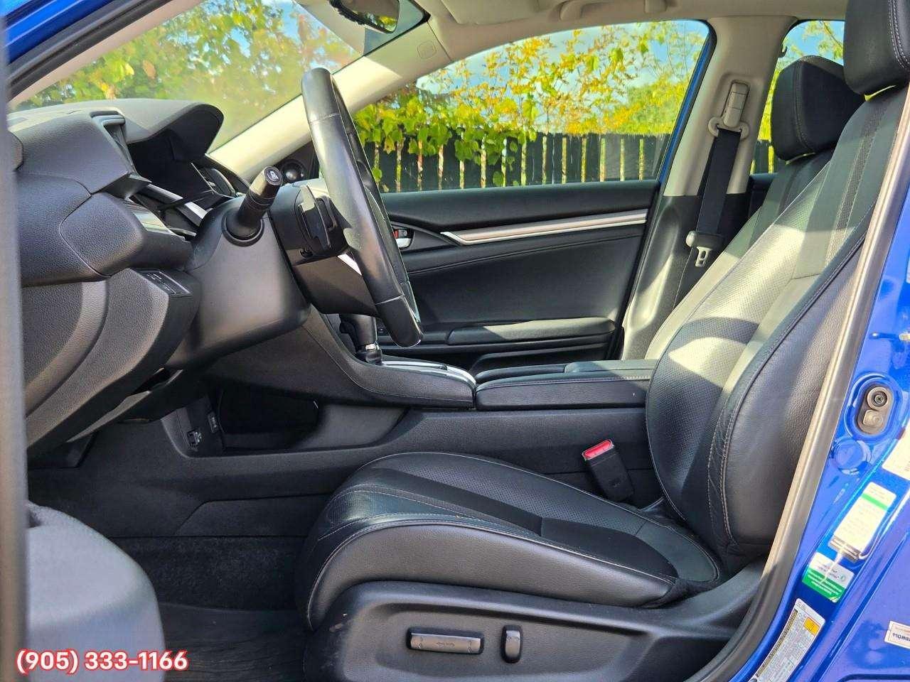 2019 Honda Civic Touring Apple CarPlay & Android Auto • Power Sunroof • Leather Seating • Built-In Navigation System • Remote Start System Photo
