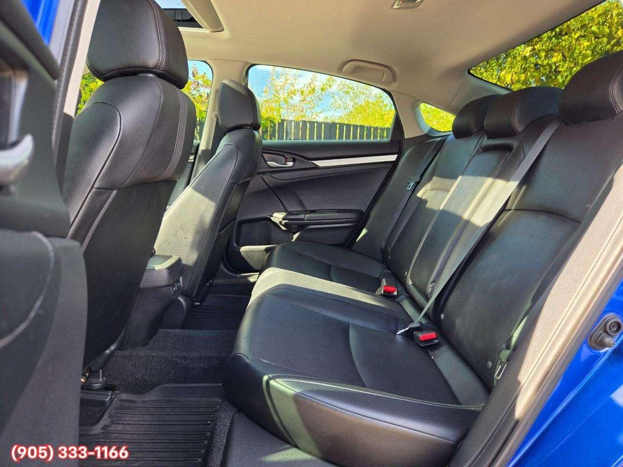 2019 Honda Civic Touring Apple CarPlay & Android Auto • Power Sunroof • Leather Seating • Built-In Navigation System • Remote Start System Photo