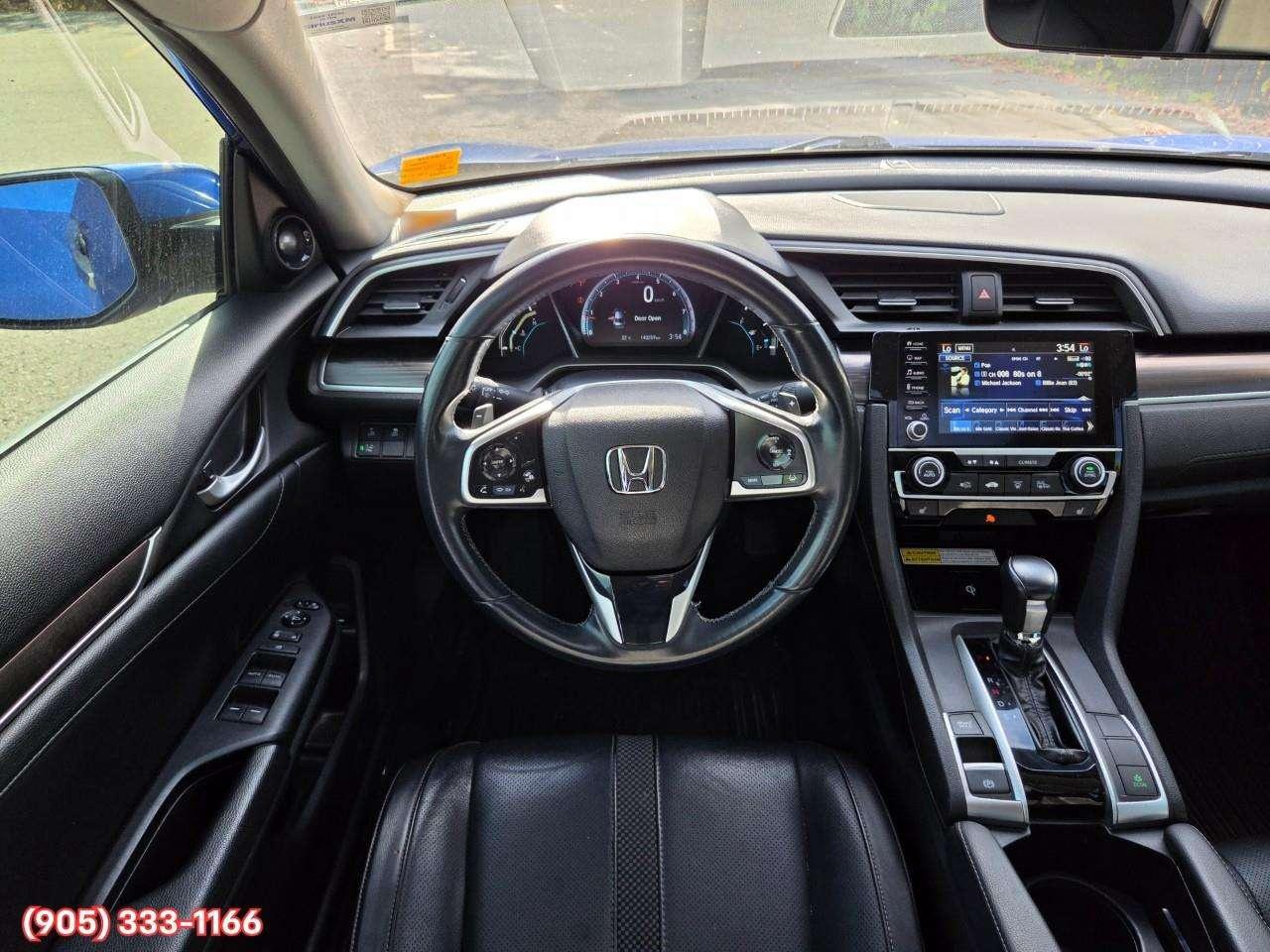 2019 Honda Civic Touring Apple CarPlay & Android Auto • Power Sunroof • Leather Seating • Built-In Navigation System • Remote Start System Photo