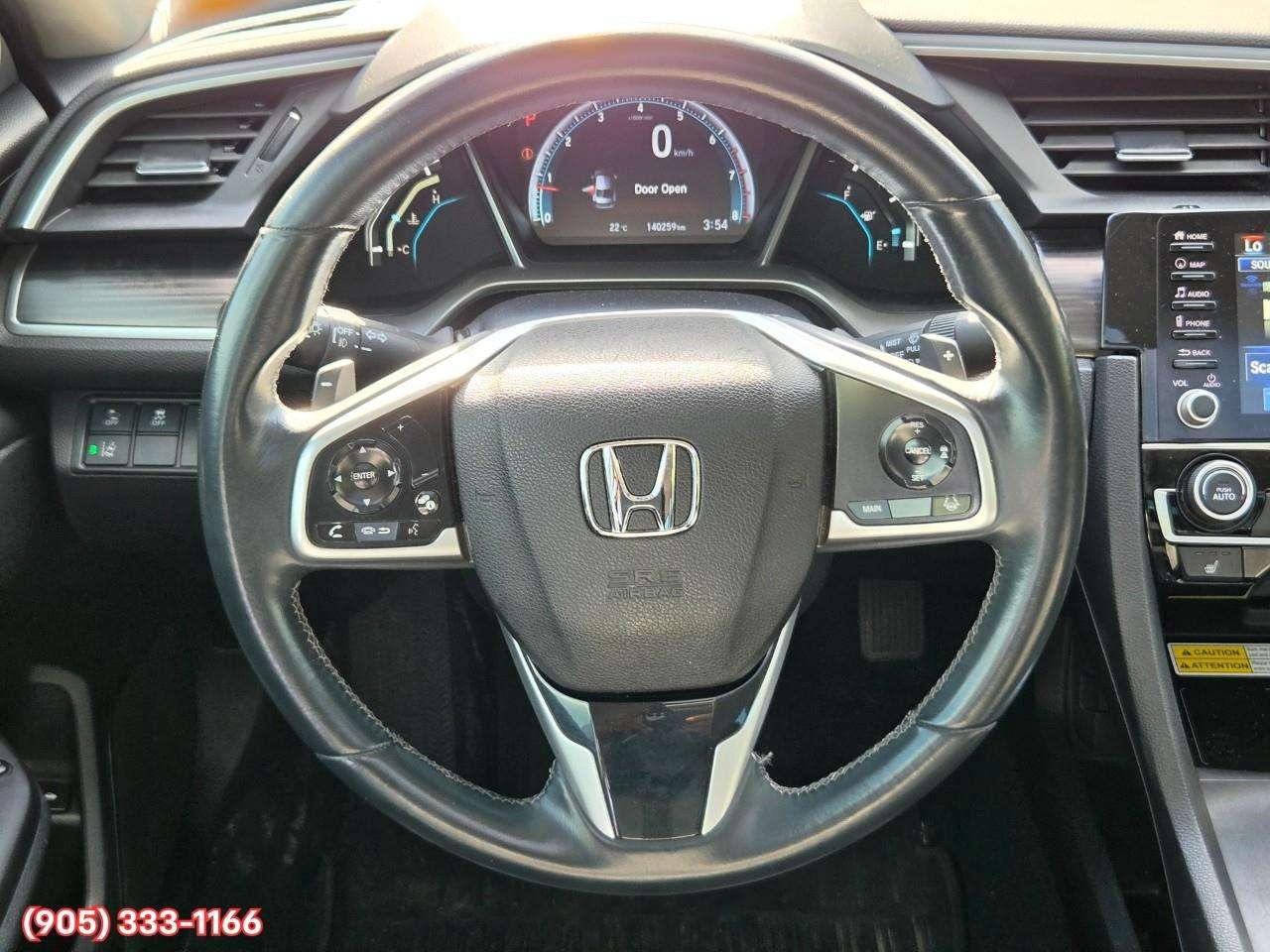 2019 Honda Civic Touring Apple CarPlay & Android Auto • Power Sunroof • Leather Seating • Built-In Navigation System • Remote Start System Photo