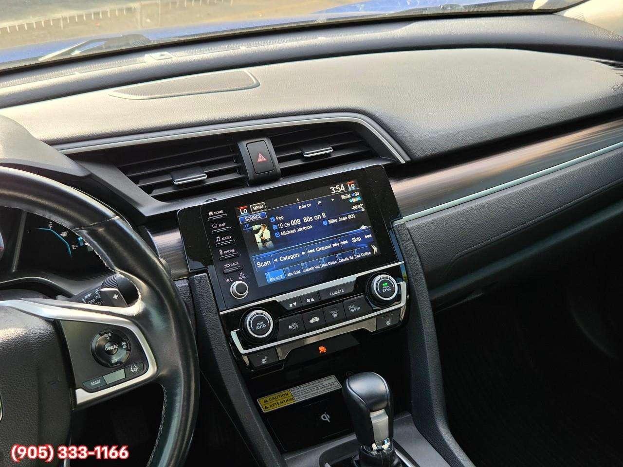 2019 Honda Civic Touring Apple CarPlay & Android Auto • Power Sunroof • Leather Seating • Built-In Navigation System • Remote Start System Photo