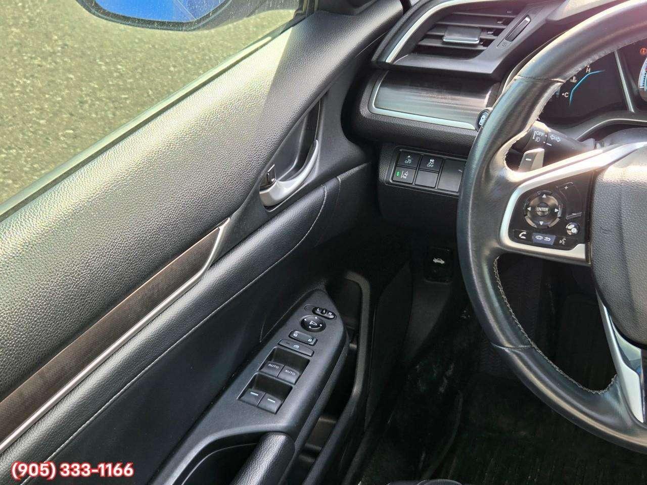 2019 Honda Civic Touring Apple CarPlay & Android Auto • Power Sunroof • Leather Seating • Built-In Navigation System • Remote Start System Photo