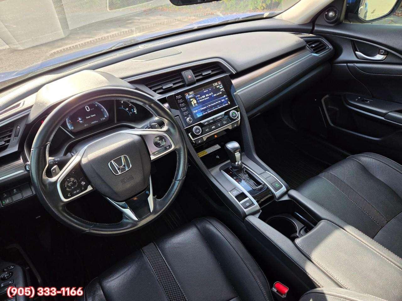 2019 Honda Civic Touring Apple CarPlay & Android Auto • Power Sunroof • Leather Seating • Built-In Navigation System • Remote Start System Photo