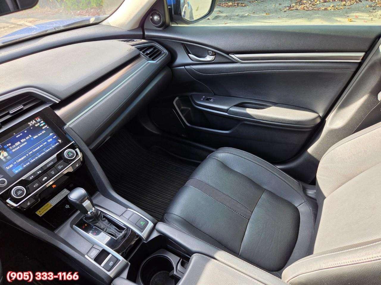 2019 Honda Civic Touring Apple CarPlay & Android Auto • Power Sunroof • Leather Seating • Built-In Navigation System • Remote Start System Photo