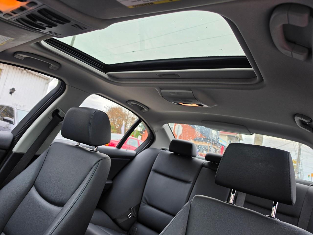 2010 BMW 3 Series 4dr Sdn 328i xDrive AWD Photo