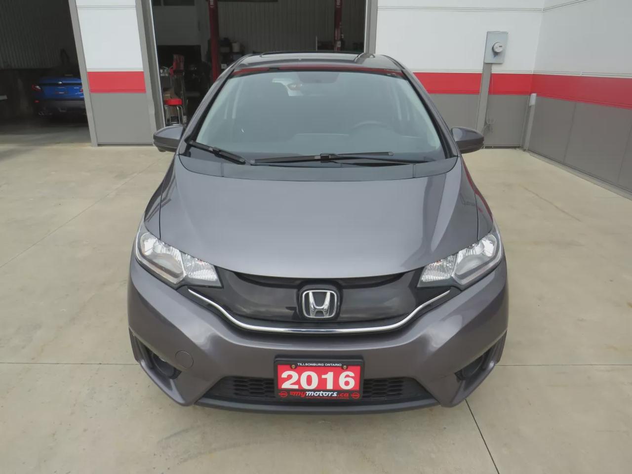 2016 Honda Fit EX | FWD | Automatic | Low Kms | Alloy Wheels | Heated Seats | Air Conditioning | Power Moonroof | Touchscreen Display | Bluetooth | Back-Up Camera | Honda LaneWatch | Cruise Control | Paddle Shifters | Steering Wheel Audio Controls | USB Input | HDMI Inp Photo