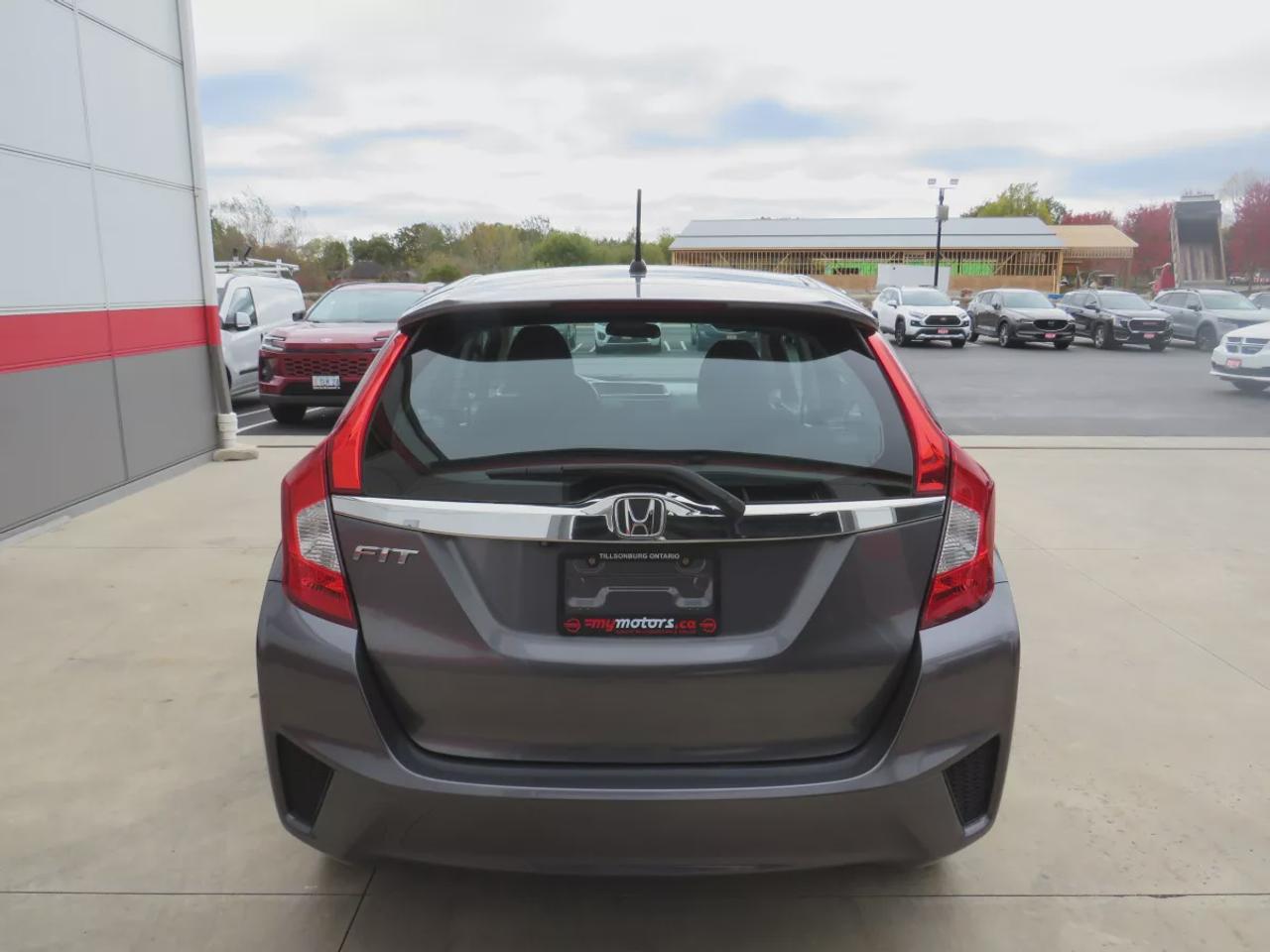 2016 Honda Fit EX | FWD | Automatic | Low Kms | Alloy Wheels | Heated Seats | Air Conditioning | Power Moonroof | Touchscreen Display | Bluetooth | Back-Up Camera | Honda LaneWatch | Cruise Control | Paddle Shifters | Steering Wheel Audio Controls | USB Input | HDMI Inp Photo