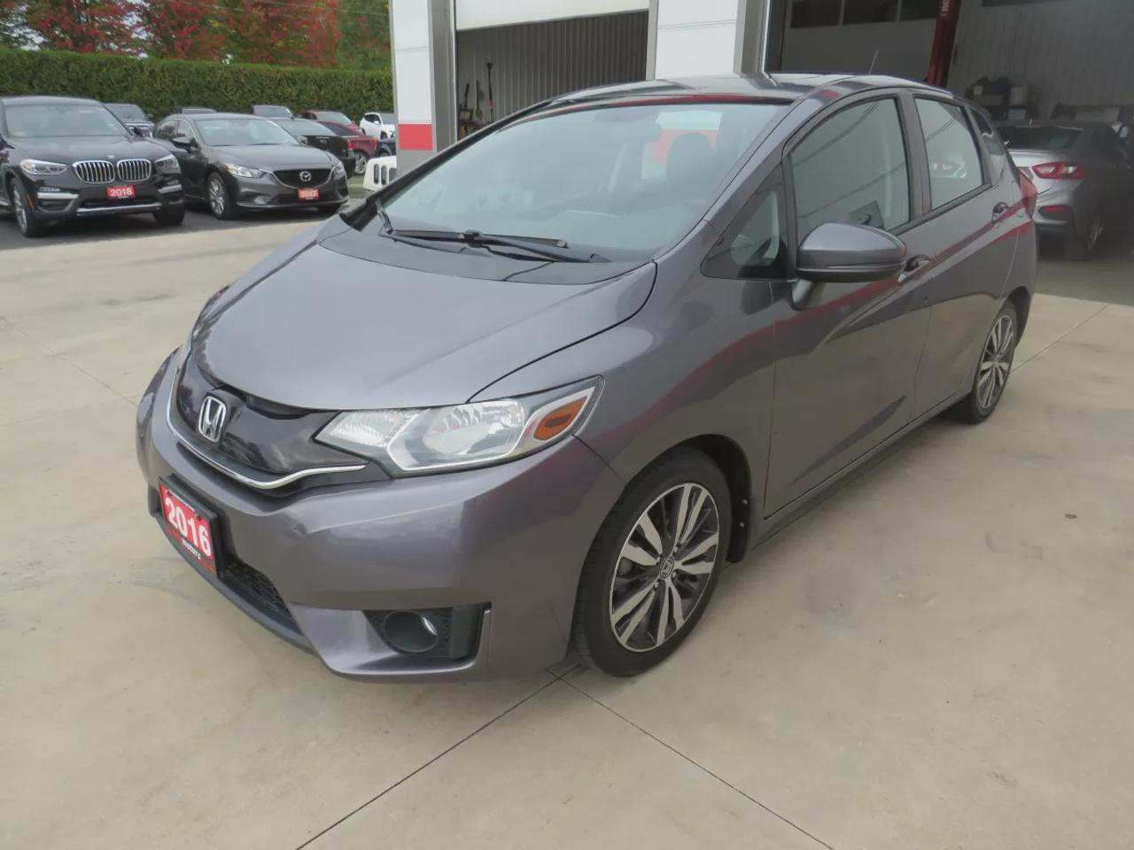 2016 Honda Fit EX | FWD | Automatic | Low Kms | Alloy Wheels | Heated Seats | Air Conditioning | Power Moonroof | Touchscreen Display | Bluetooth | Back-Up Camera | Honda LaneWatch | Cruise Control | Paddle Shifters | Steering Wheel Audio Controls | USB Input | HDMI Inp Photo