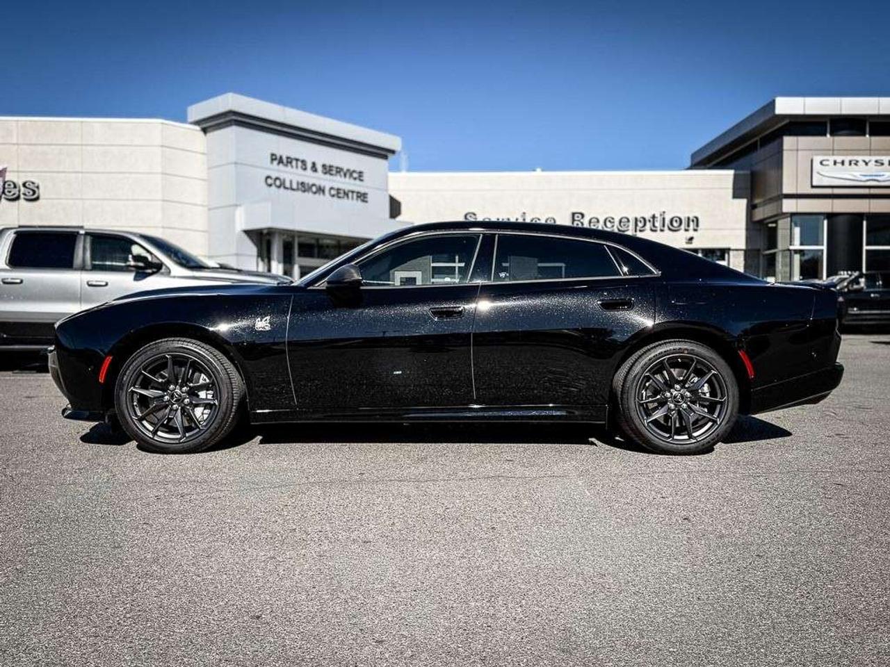 2026 Dodge Charger Scat Pack   4-DOOR   PLUS   BLACKTOP   CARBON & SUEDE   GLASS ROOF   HEATED/VENTILATED LEATHER   ALPINE AUDIO Photo