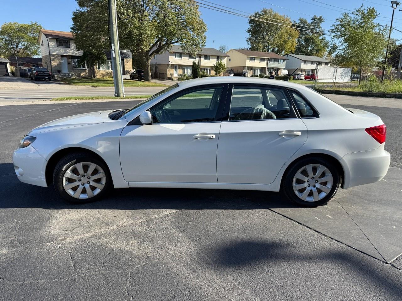 2010 Subaru Impreza 4dr Sdn Auto 2.5i Photo3
