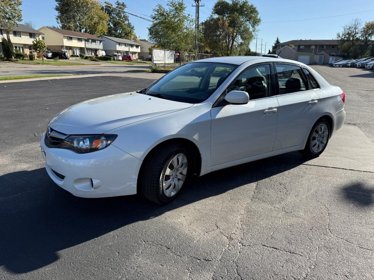 2010 Subaru Impreza 4dr Sdn Auto 2.5i Photo2