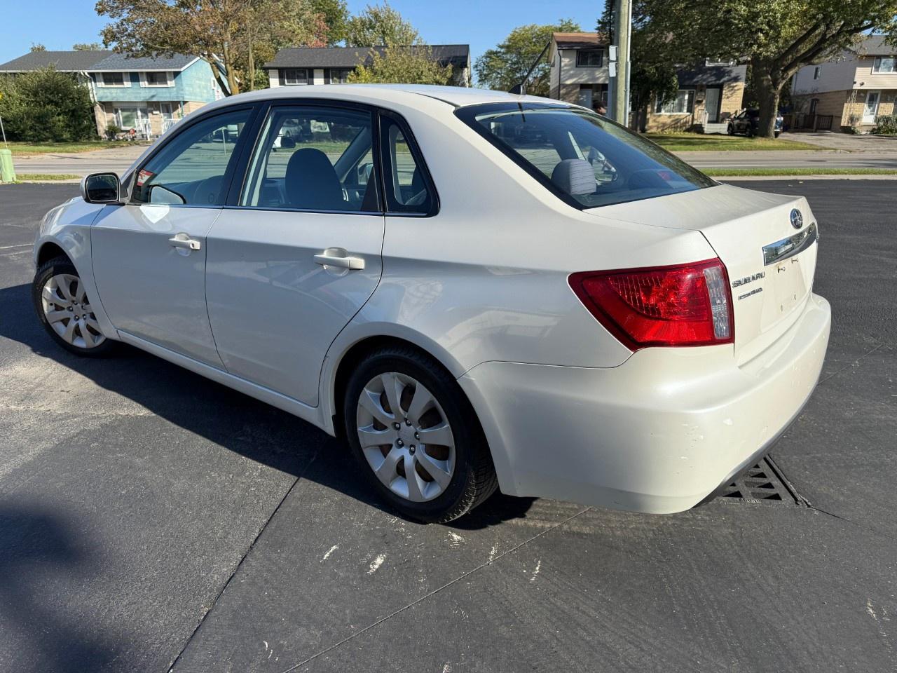 2010 Subaru Impreza 4dr Sdn Auto 2.5i Photo