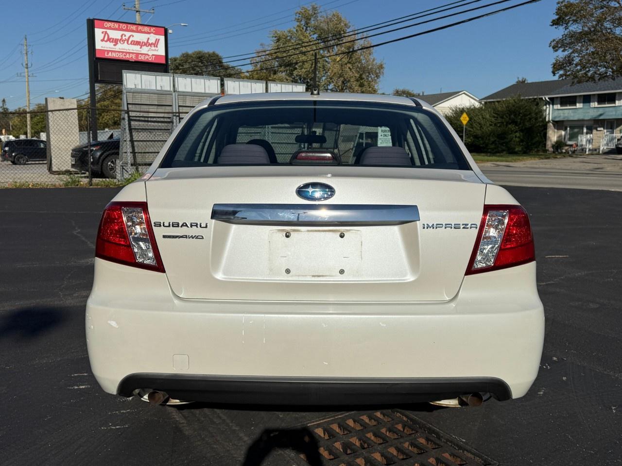 2010 Subaru Impreza 4dr Sdn Auto 2.5i Photo
