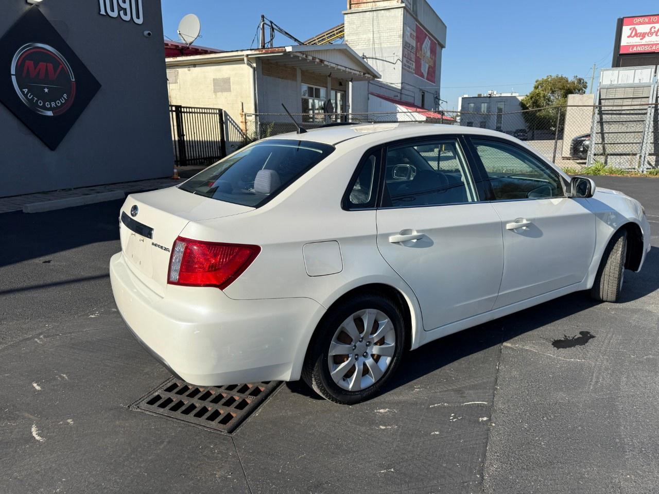 2010 Subaru Impreza 4dr Sdn Auto 2.5i Photo