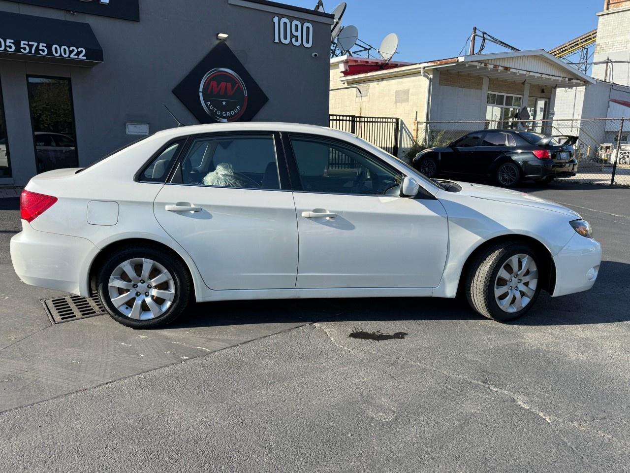 2010 Subaru Impreza 4dr Sdn Auto 2.5i Photo