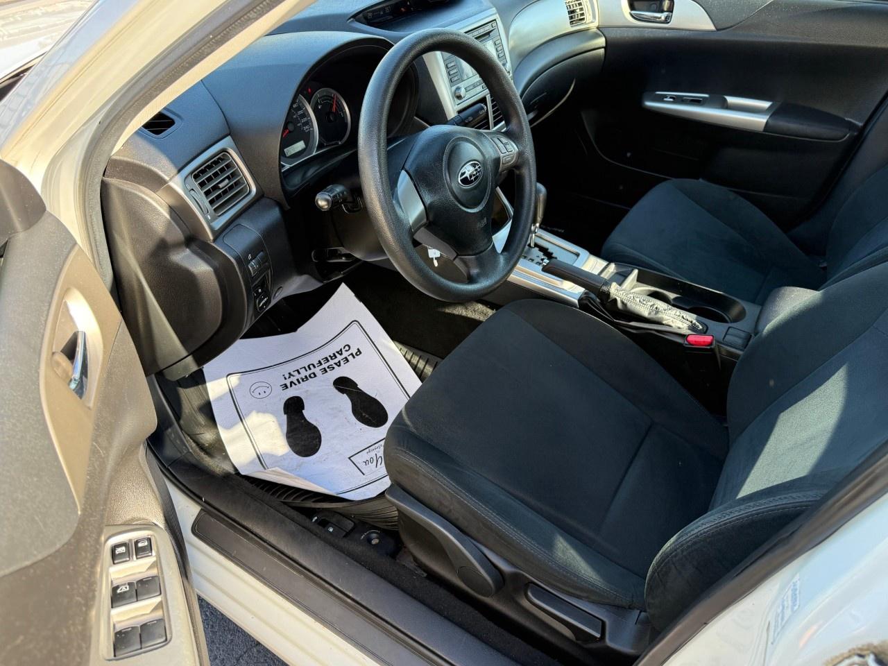 2010 Subaru Impreza 4dr Sdn Auto 2.5i Photo