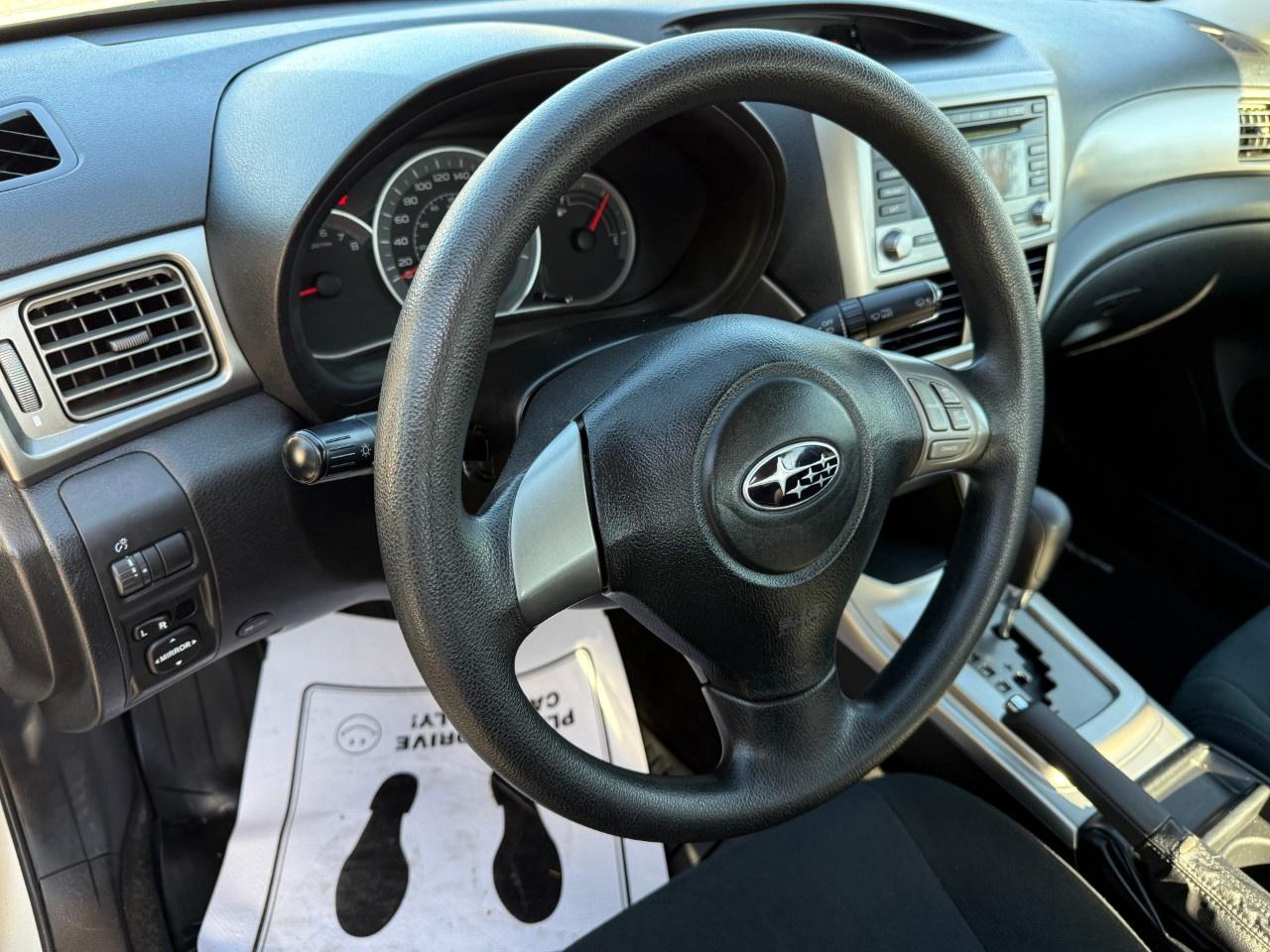 2010 Subaru Impreza 4dr Sdn Auto 2.5i Photo