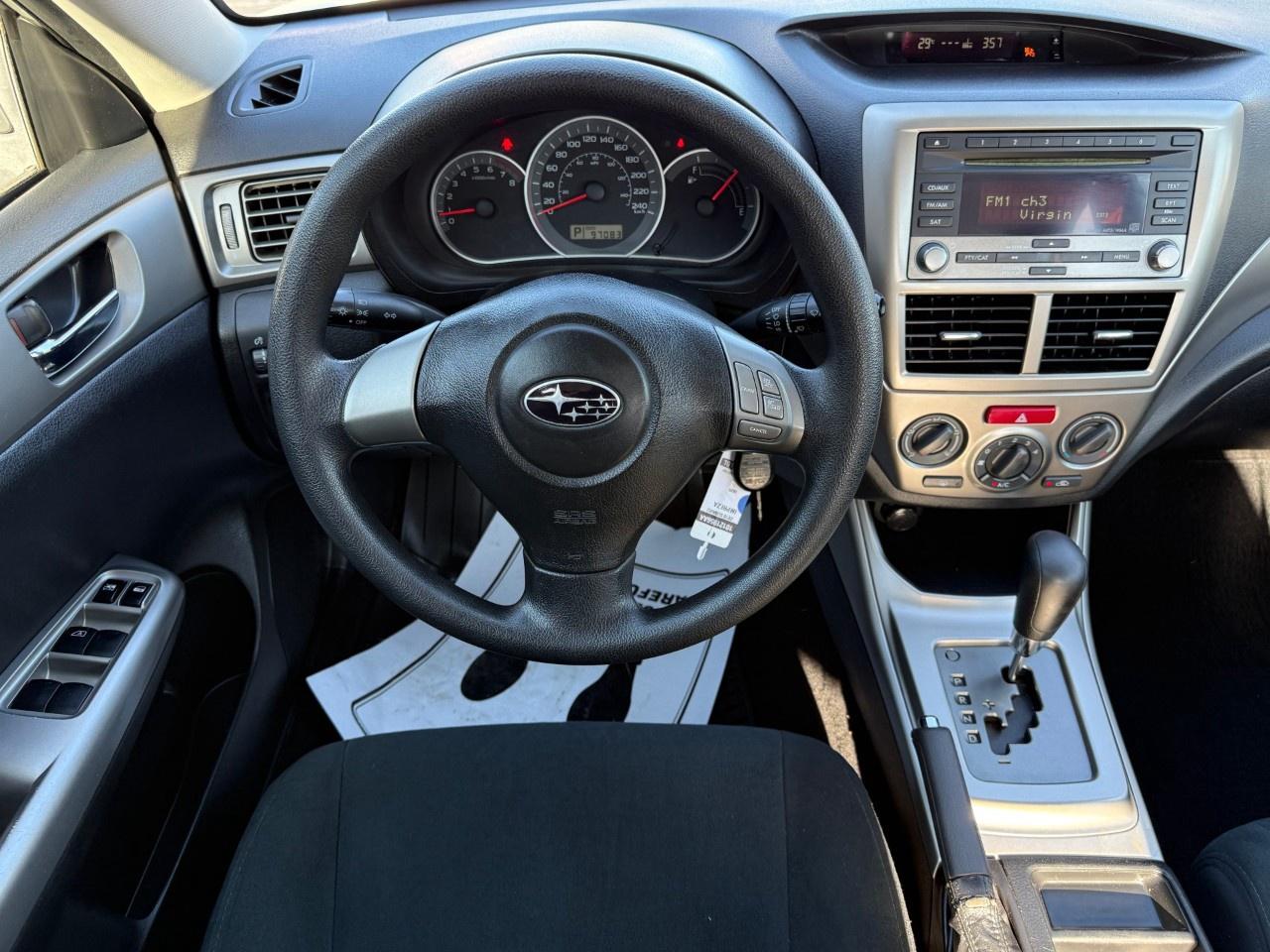 2010 Subaru Impreza 4dr Sdn Auto 2.5i Photo