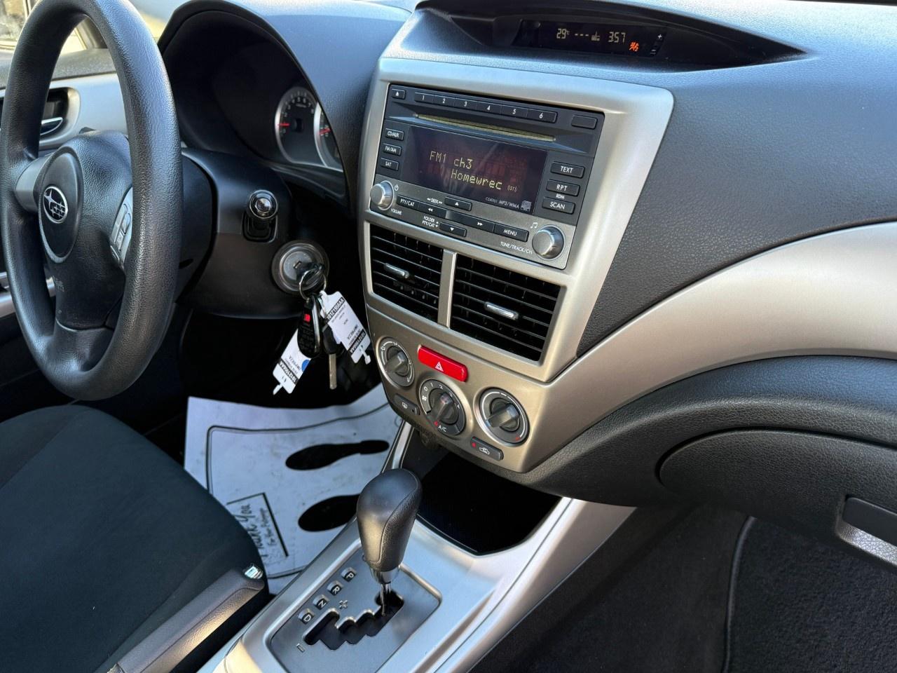 2010 Subaru Impreza 4dr Sdn Auto 2.5i Photo