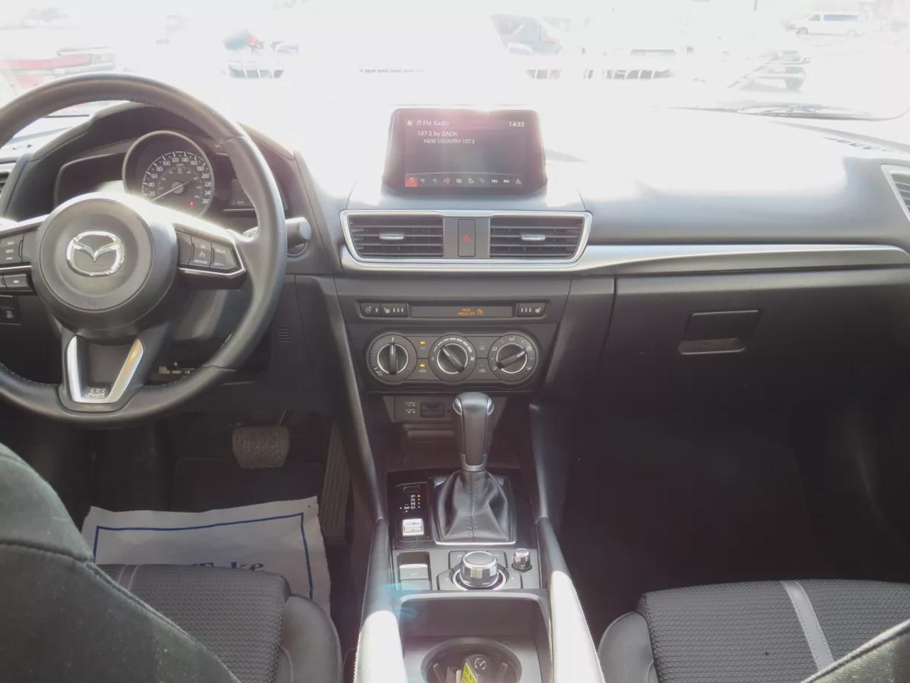 2017 Mazda MAZDA3 GS | LOW KMS | FWD | Automatic | Alloy Wheels | Heated Seats | Heated Steering Wheel | Air Conditioning | Touchscreen Display | Bluetooth | Back-Up Camera | Blind Spot Monitor | Cruise Control | Rain-Sensing Wipers |  Heated Power Mirrors Photo